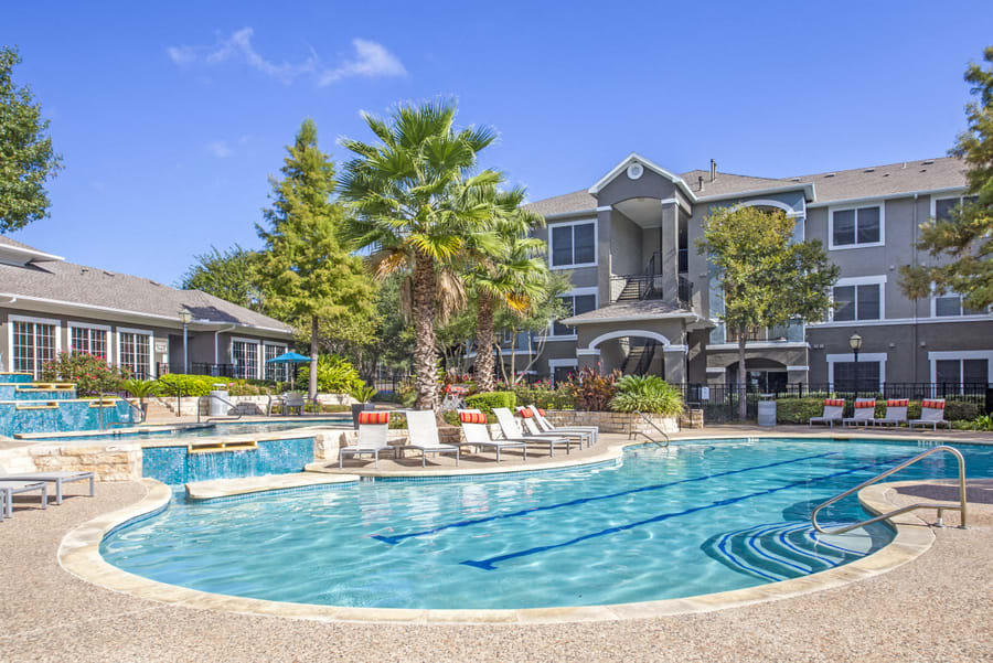 Nolina Flats exterior building with landscaping and pool views - Austin, TX