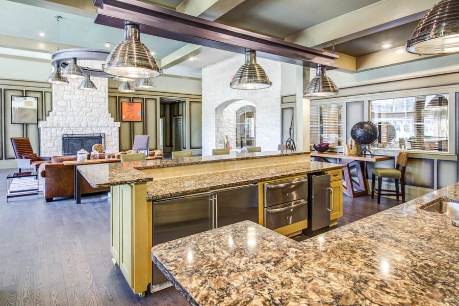 Abelia Flats community kitchen with mini fridge, oven, and sink - Austin, TX