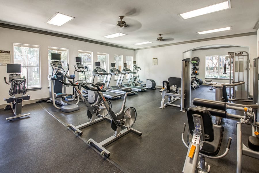 Abelia Flats fitness center with cardio and weight equipment - Austin, TX