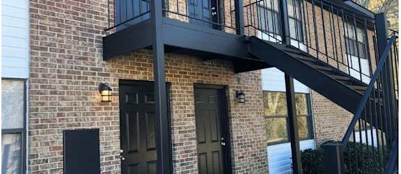 a building with a balcony and a fire escape
