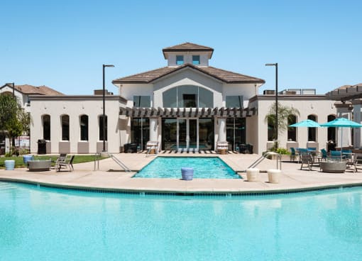 Apartment Rocklin CA - The James - Pool with Umbrella Tables and Seating Areas, Decor, and Landscaping