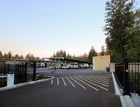 A parking lot with a yellow line in the middle of the lot.