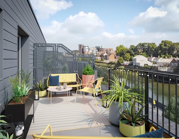 a roof terrace with yellow furniture and plants