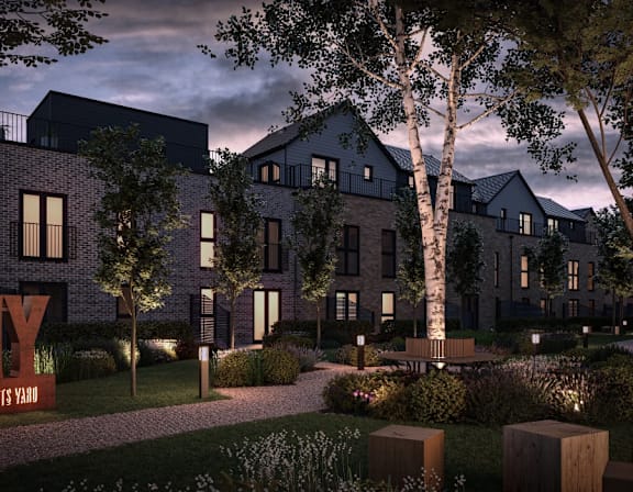 a rendering of an apartment building with a courtyard and trees