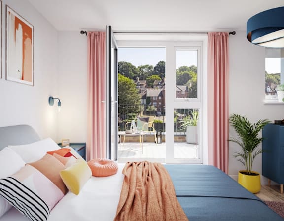 a bedroom with a bed and a door to a patio