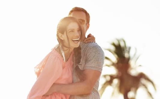 a couple hugging each other with a smile on their face at Altis Blue Lake, Lake Worth