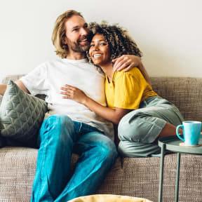 a man and a woman sitting on a couch