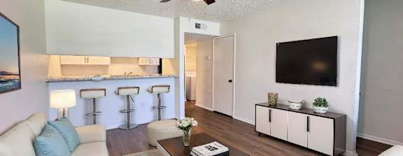 a living room with a couch and a tv