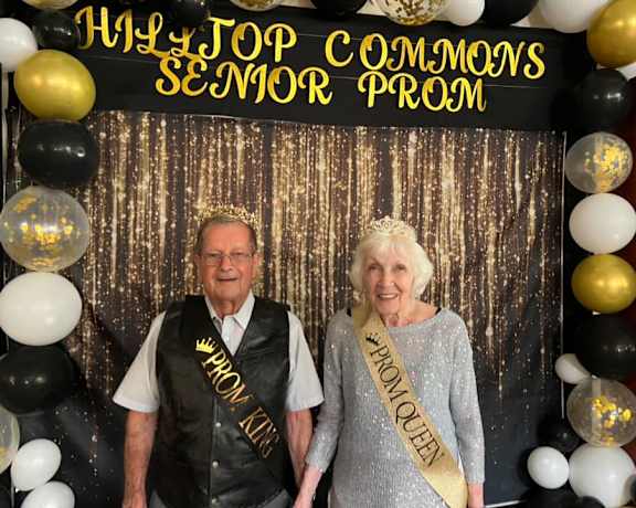 A man and a woman are dressed up for a prom at Hilltop Commons Senior Living, Grass Valley