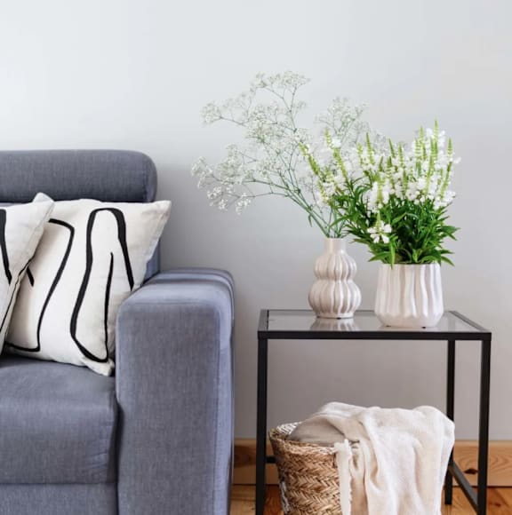 a rendering of a living room with a couch and a table at Cedar Crossing, Seattle, WA, 98115
