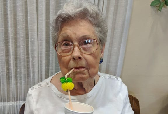 senior lady with a drink at Savannah Court of Brandon, Brandon