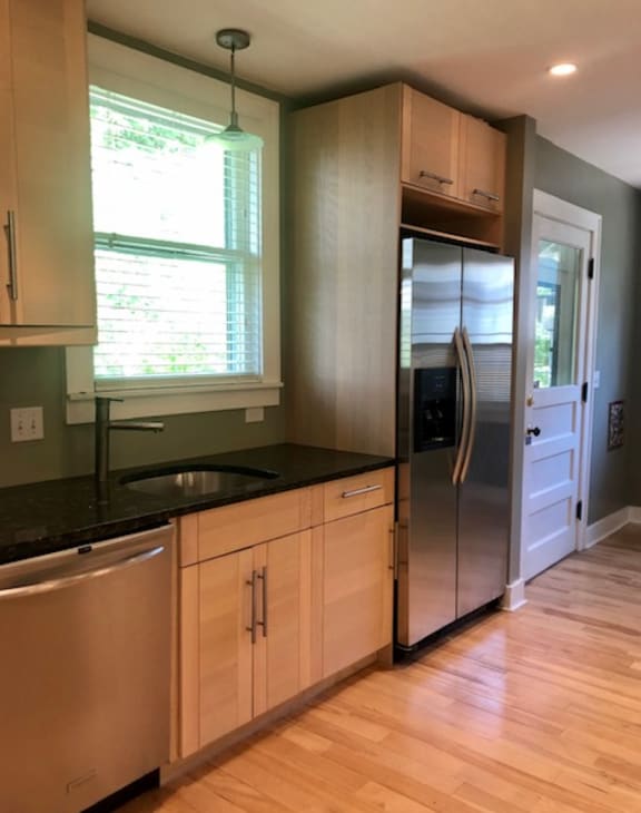 a kitchen with a sink and a refrigerator