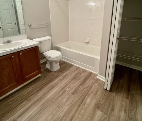 a bathroom with a toilet sink and bathtub