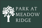 a white tree on a green background with the words park at meadow ridge