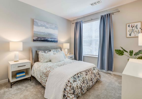 a bedroom with a bed and two night stands at Delamarre at Celebration, Florida, 34747