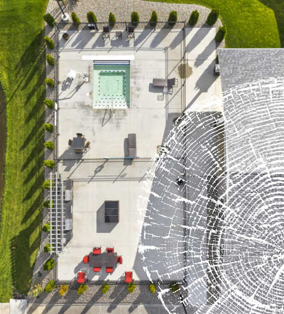 A top down view of a courtyard with a pool table and a spider web.