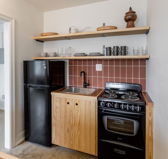 a bedroom with a bed and a door to a bathroom