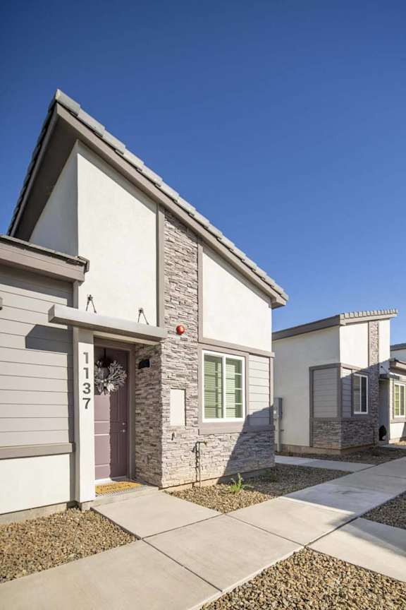 a street view of a house with a sidewalk at Grandstone at Sunrise, Peoria, AZ, 85383