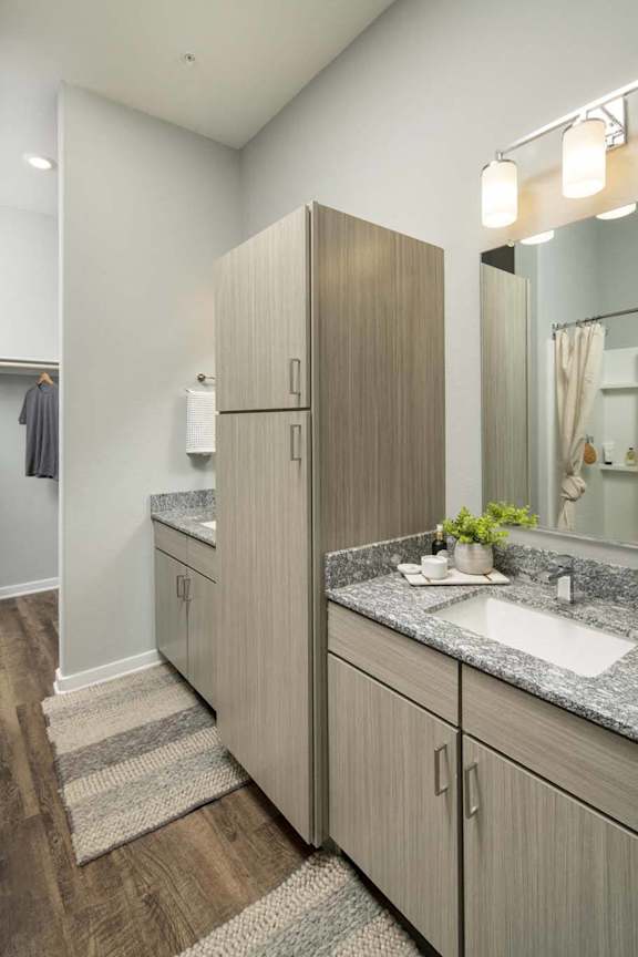 a bathroom with two sinks and a large closet at Grandstone at Sunrise, Peoria, AZ, 85383