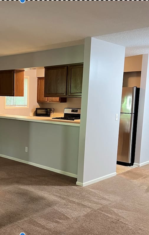 an empty living room with a sliding glass door