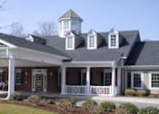 Thumbnail 2 of 3 - a large white house with a porch and a