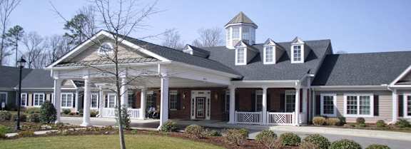 a large white house with a porch and a