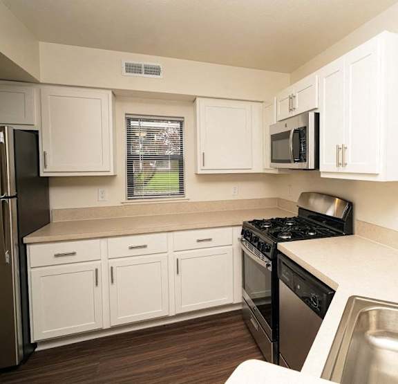 Kitchen with stainless steel appliances at Arbor Lakes Apartments, Elkhart, IN, 46516