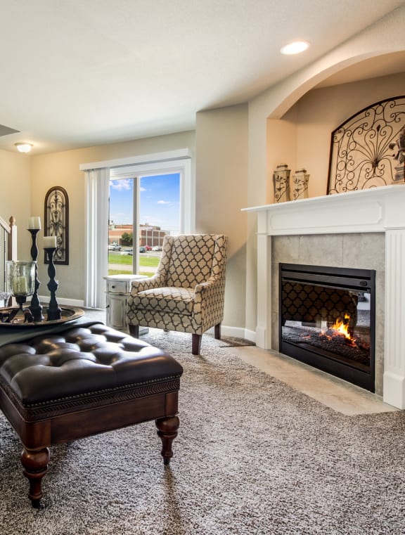 a living room with a fireplace and an
