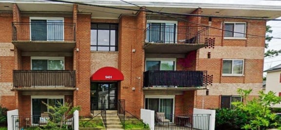 a building with a red awning in front of it