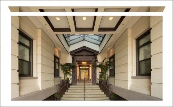 the lobby of a building with stairs and a glass ceiling  at The Mount Royal, Maryland, 21202