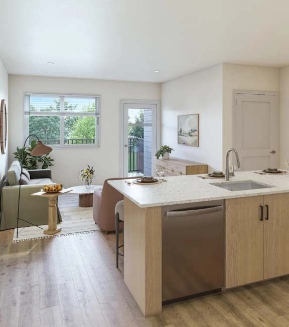 A modern kitchen with a large island and stainless steel appliances.