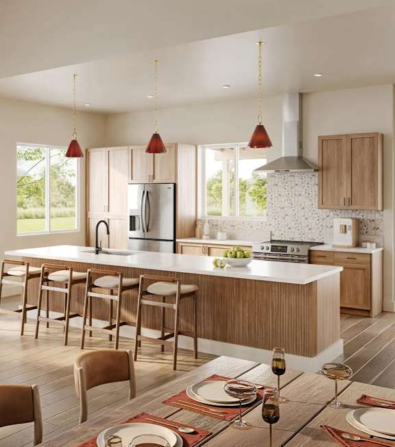 A modern kitchen with a bar area and wooden chairs.