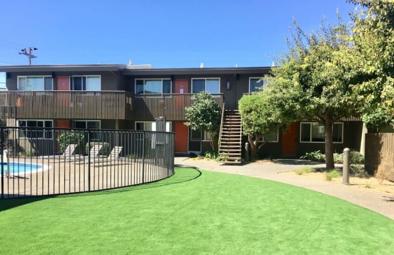 a yard in front of a building with a pool at Element LLC, Sunnyvale, 94086