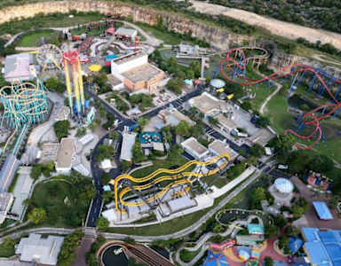 An aerial view of a theme park with various rides and attractions.