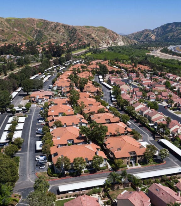 an aerial view of a neighborhood with houses and trees at The Bryant Apartments at Yorba Linda, Yorba Linda