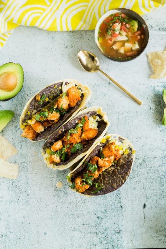 Tacos on table with salsa at Mirabella Apartments, California, 92203