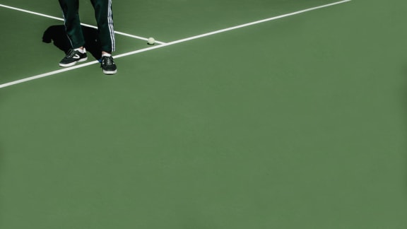 Stylish person standing on tennis court at Mirabella Apartments, Bermuda Dunes, CA
