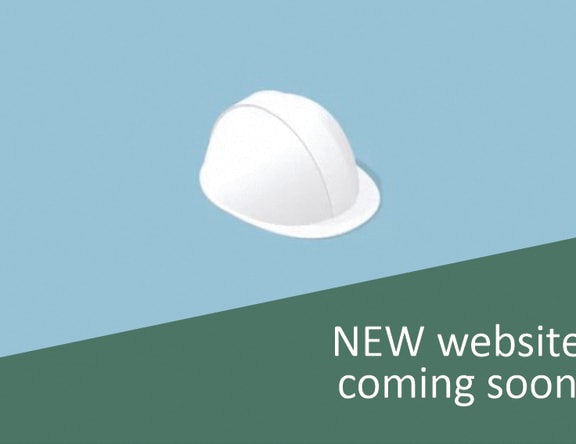 a graphic of a new website coming soon and a white hat