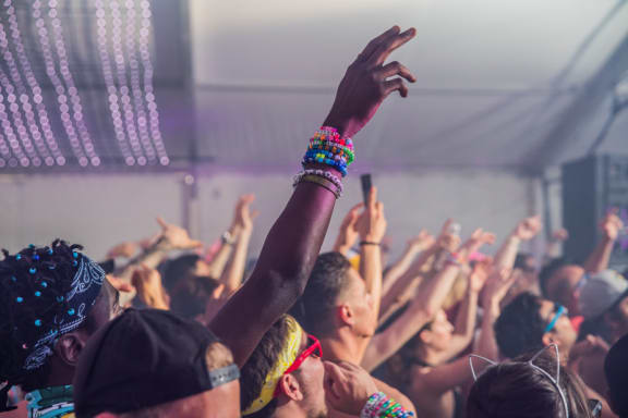 People with hands in air at concert near Mirabella Apartments, Bermuda Dunes, 92203