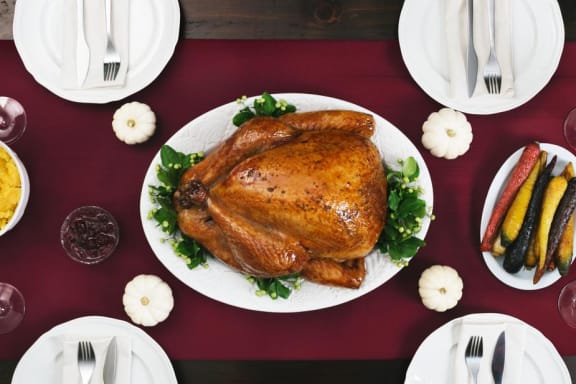 Turkey on table with side dishes at Mirabella Apartments, CA, 92203