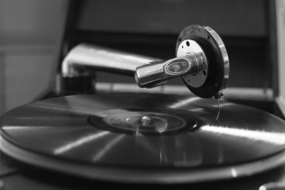 Vinyl record on record player at Mirabella Apartments, 92203, CA
