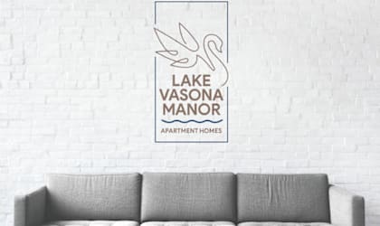 a poster of the lake vasona manor apartments logo on a white wall