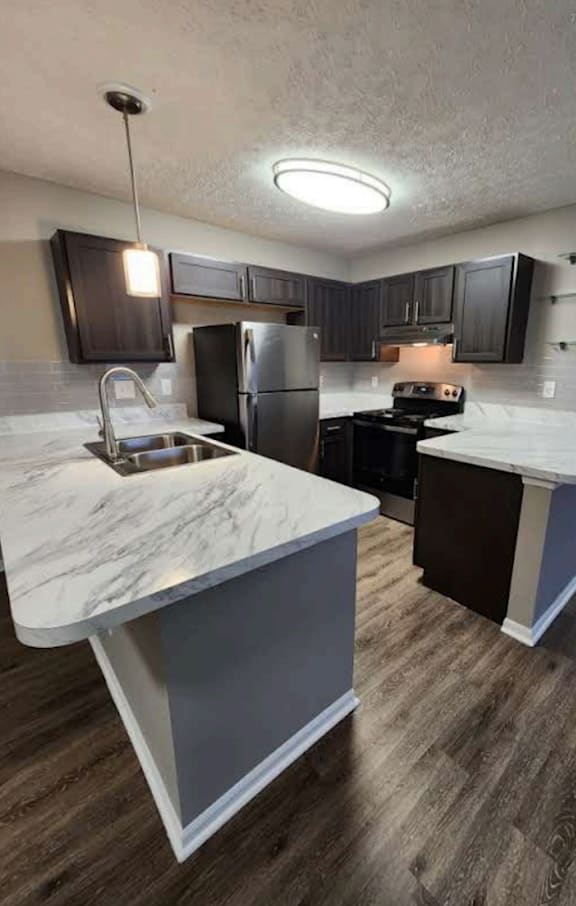 a kitchen with a sink and a counter top in a house