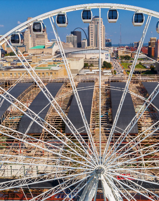 a ferris wheel in front of a city