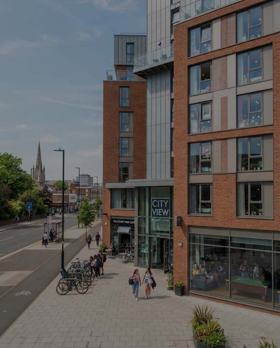 A street view of a city with a building named City View.