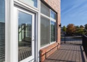 Thumbnail 40 of 48 - the balcony of a home with windows and a door