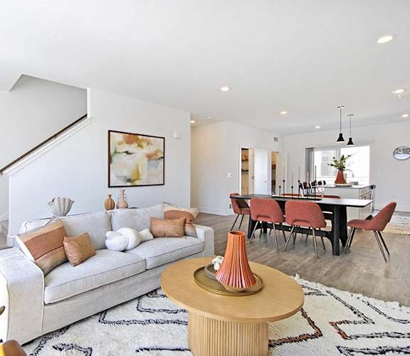 a living room and dining room with a couch and a table
