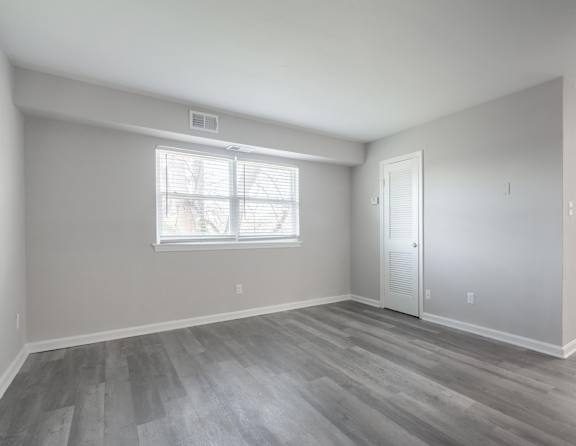 A room with a window and a door.