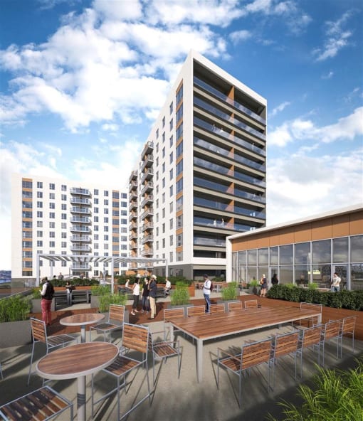 a rendering of an outdoor patio with tables in front of a tall building