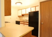 Thumbnail 4 of 18 - Image of a kitchen with cabinets and appliances